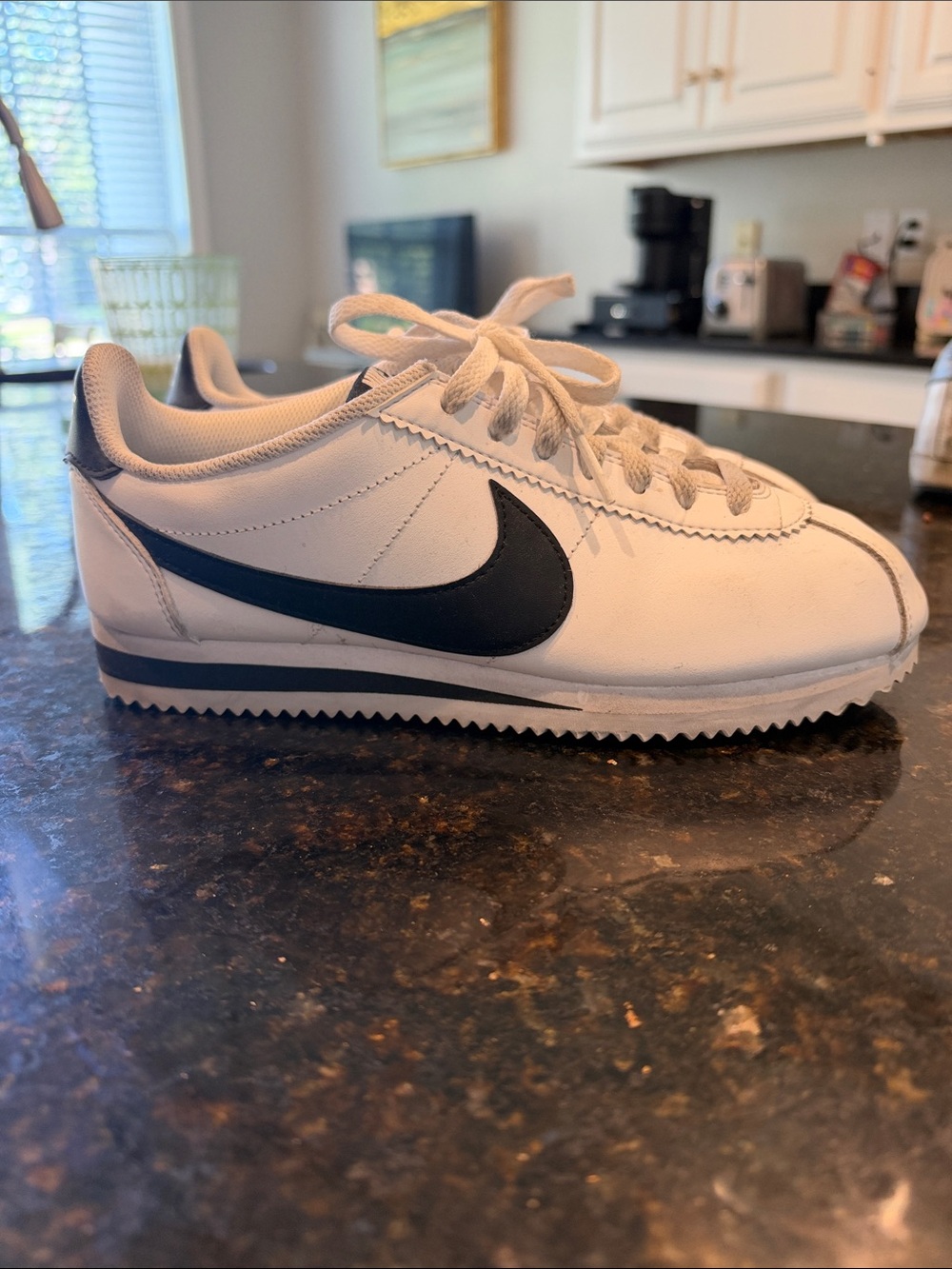 Nike Women’s White Cortez Leather Sneaker with Black Swoosh